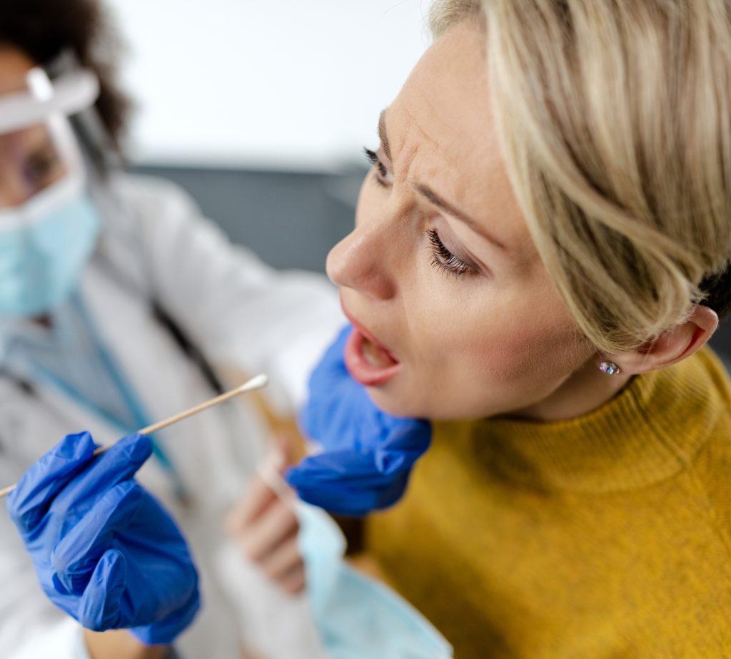 Female patient during coronavirus PCR testing at the hospital.